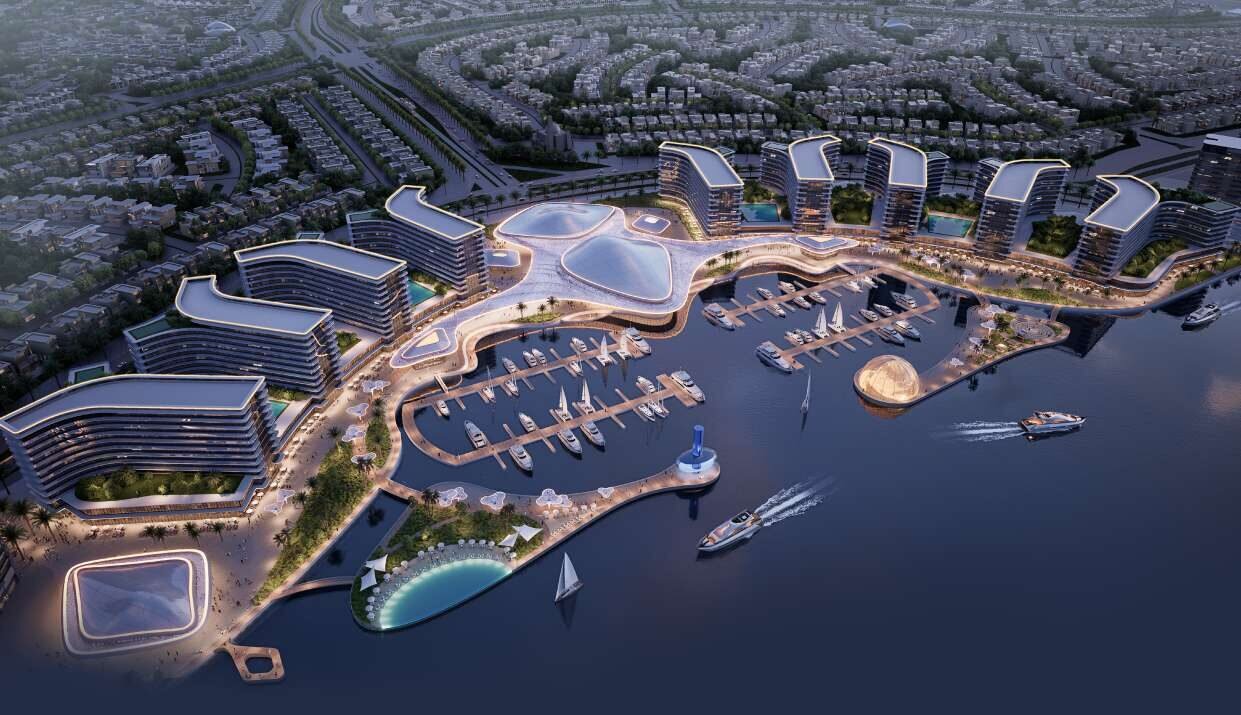 Aerial of Sobha City marina with apartment towers along the waterfront